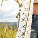 Demasiado knitted cover up with green crochet
